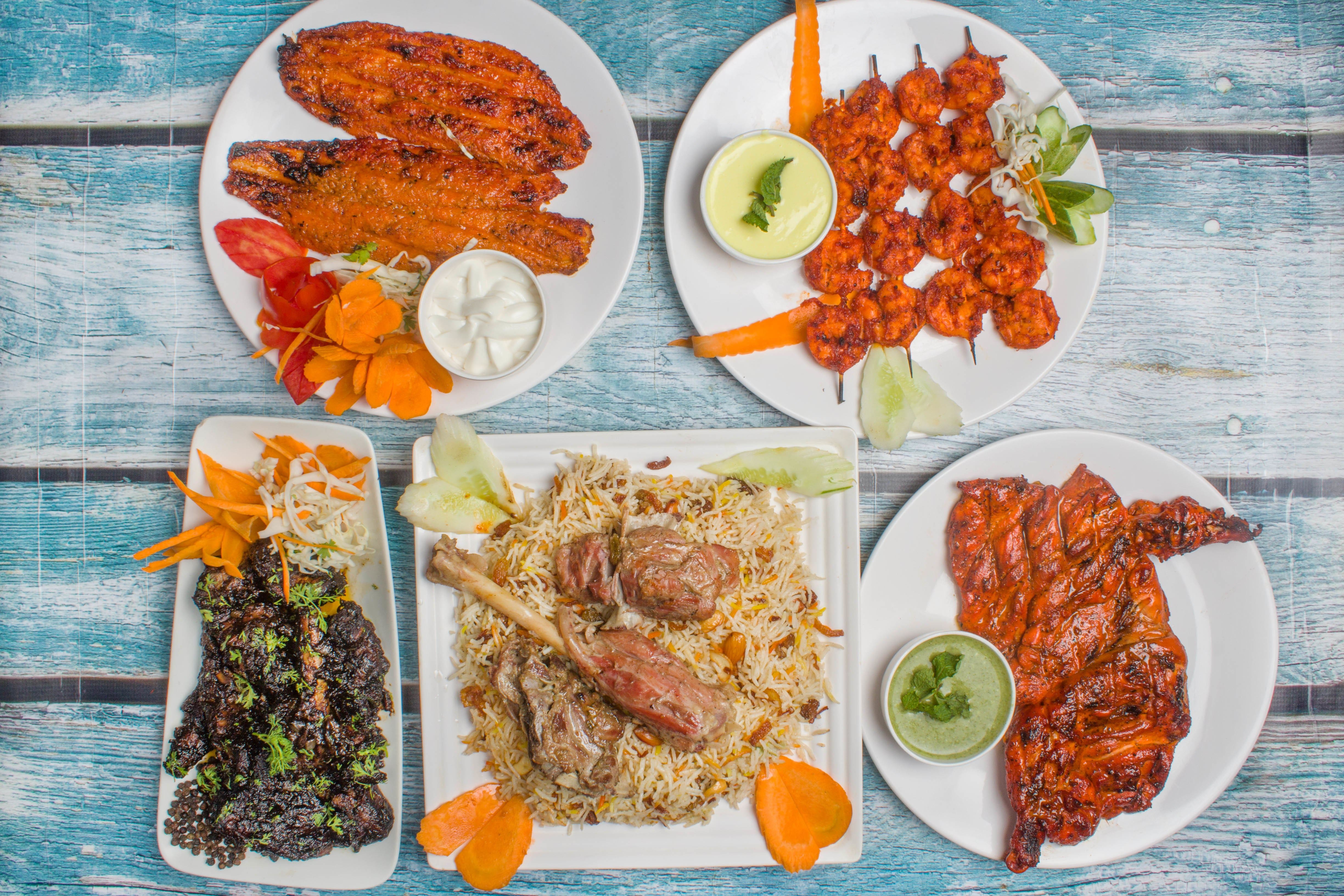 Overhead mandi spread with mutton, grilled chicken and kebabs at Mandi@36